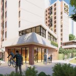 Varios edificios de apartamentos modernos con grandes ventanales rodean un patio donde la gente pasea, monta en bicicleta y se reúne. La zona exterior está repleta de árboles y vegetación exuberante.