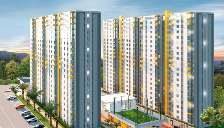 Un moderno complejo de apartamentos de Entreguaduas con altos edificios blancos con detalles amarillos, rodeados de vegetación, una pista deportiva, coches aparcados y gente caminando por los senderos al atardecer.