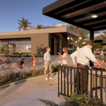 La gente se reúne en Villabosque Nativo, una moderna zona al aire libre con vegetación, palmeras y edificios contemporáneos. Algunos se relajan en las escaleras, mientras otros socializan o asan comida bajo una pérgola, todos disfrutando del día soleado.