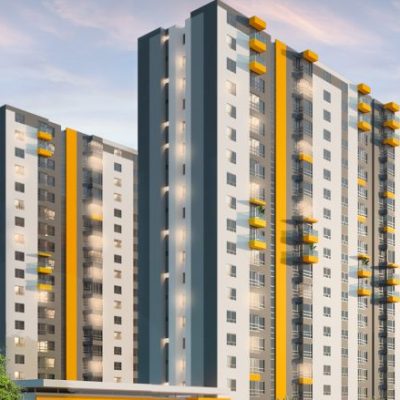 Altos y modernos edificios de apartamentos Entreguaduas con exteriores blancos y grises, con acentos y balcones amarillos, se yerguen sobre un cielo azul con algunas nubes y árboles en primer plano.