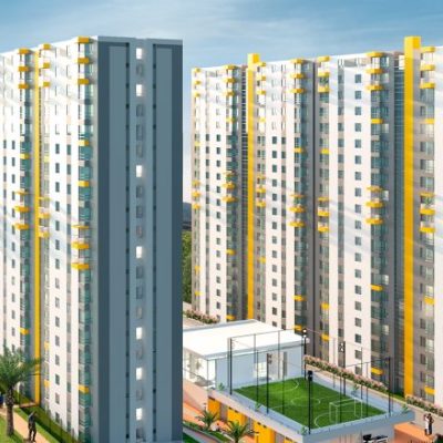 Un moderno complejo de apartamentos de Entreguaduas con altos edificios blancos con detalles amarillos, rodeados de vegetación, una pista deportiva, coches aparcados y gente caminando por los senderos al atardecer.