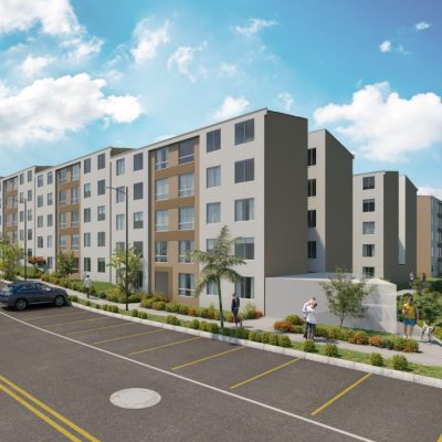 Un moderno complejo de apartamentos, Reserva de Llano Grande, presenta edificios de cinco plantas, zonas verdes ajardinadas, coches aparcados y gente caminando por la acera bajo un cielo parcialmente nublado.